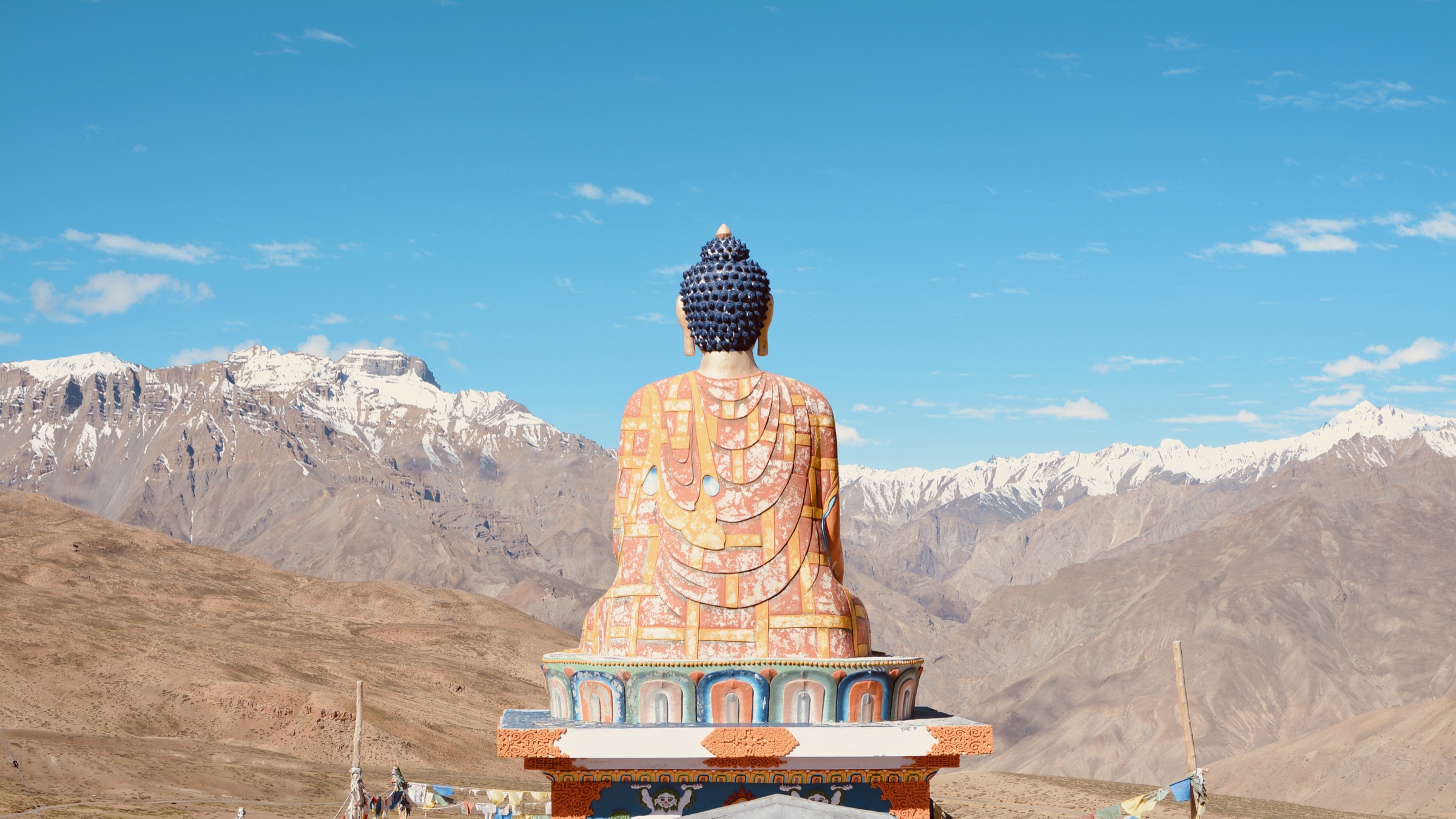 Buddha statue against Himalayan ranges